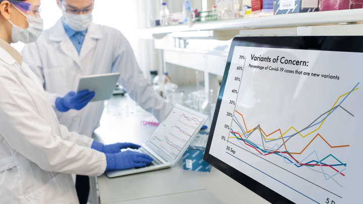 QIAseq SARS-CoV-2 kit, campaign visual for QIAseq DIRECT Library Kit, two scientists in a laboratory working on computer screens,